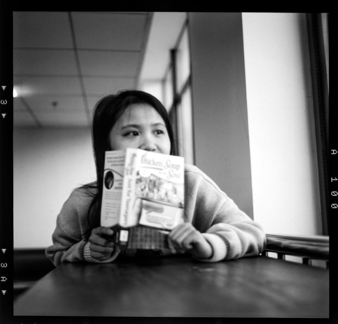Female tech journalist with a confident expression
