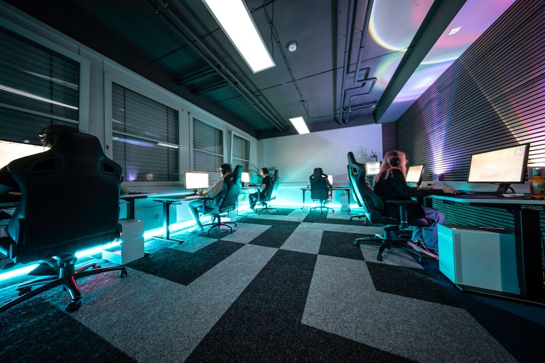 Modern tech newsroom with journalists and editors working at computers
